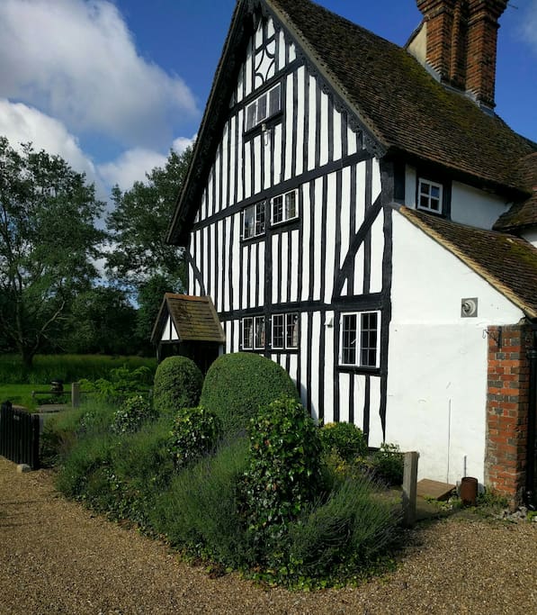 Side view if the cottage showing many beams.