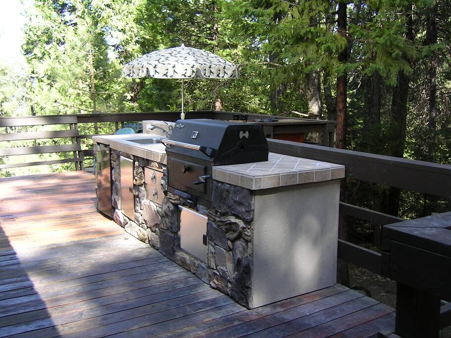 side deck with outdoor kitchen and grill