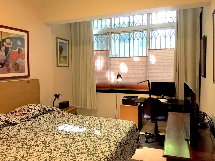 Smart TV 42" LED. View of beautiful Trees outside. Bottom-up blinds for privacy.