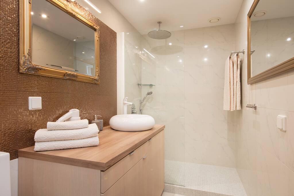 Spacious bathroom with a walk-in rain shower