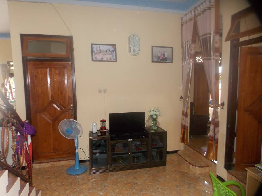 Living room. We gather in this room to have a chat or enjoy television program. No sofas here.