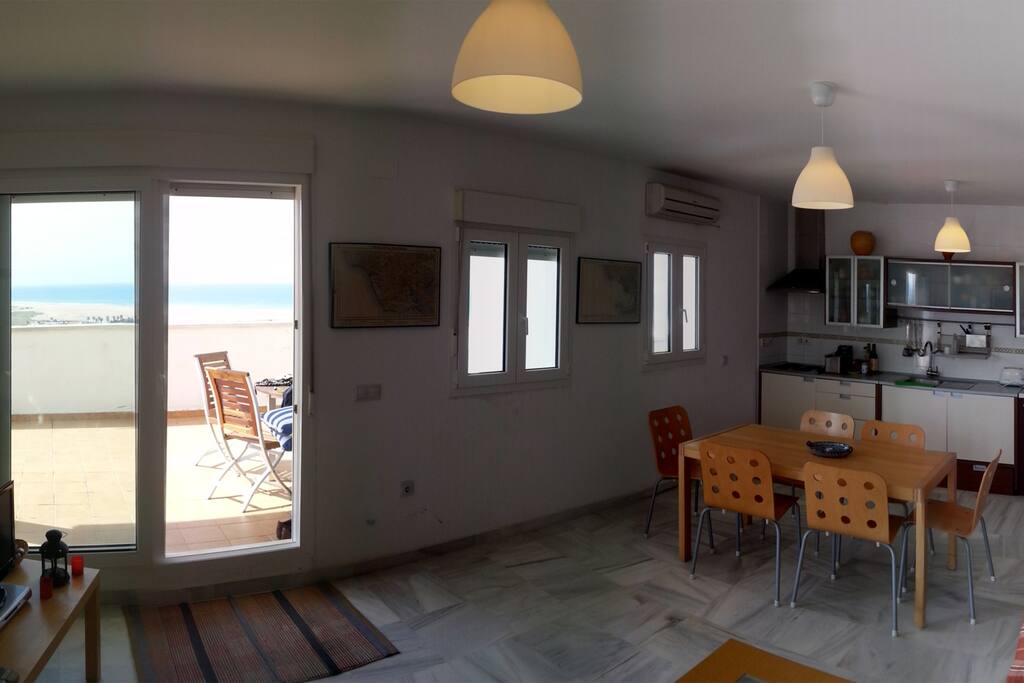 Living room with kitchen and terrace at the back