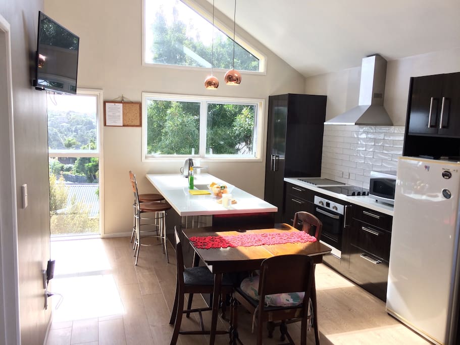 Enjoy full kitchen with all major appliances and island bench with washing machine / dryer.