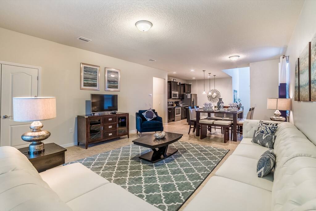 Living room with leather sectional sofa with flat screen TV