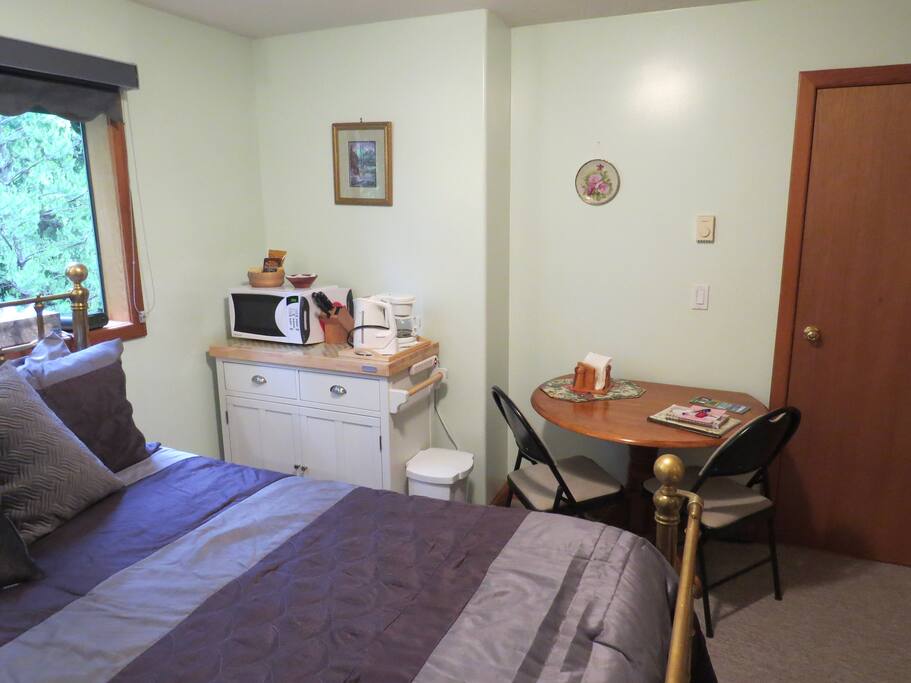 Microwave, coffee maker, table for 2.