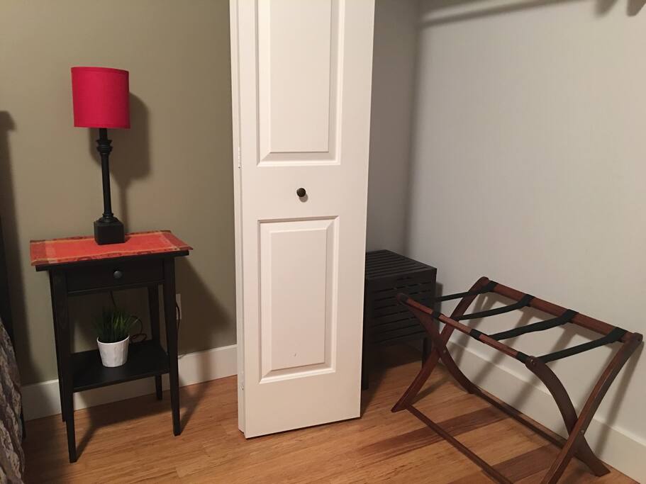Large closet with luggage rack.