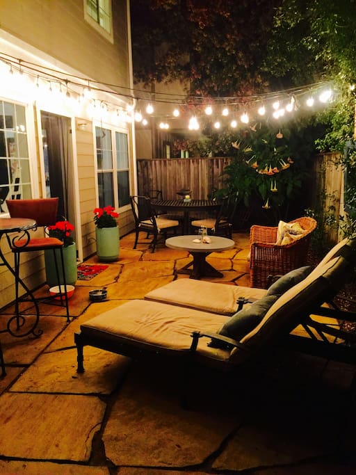 The cozy backyard is sunshiny and adds another room in the outdoor cozy space. BBQ and take a nap!