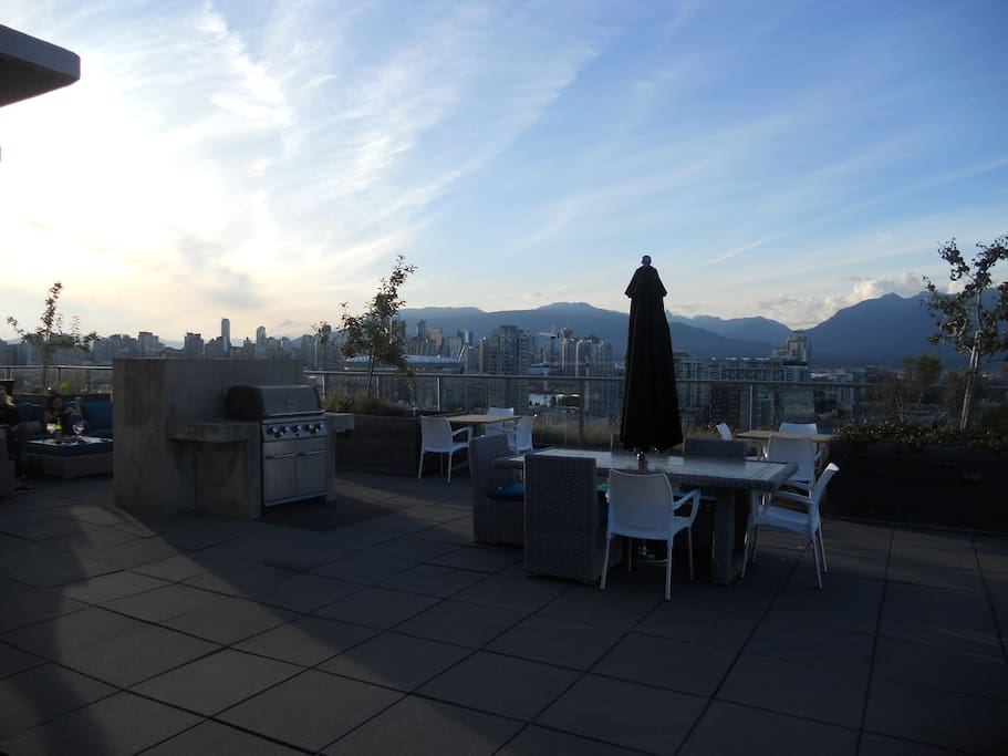 Roof top patio with stunning city and sunset views.