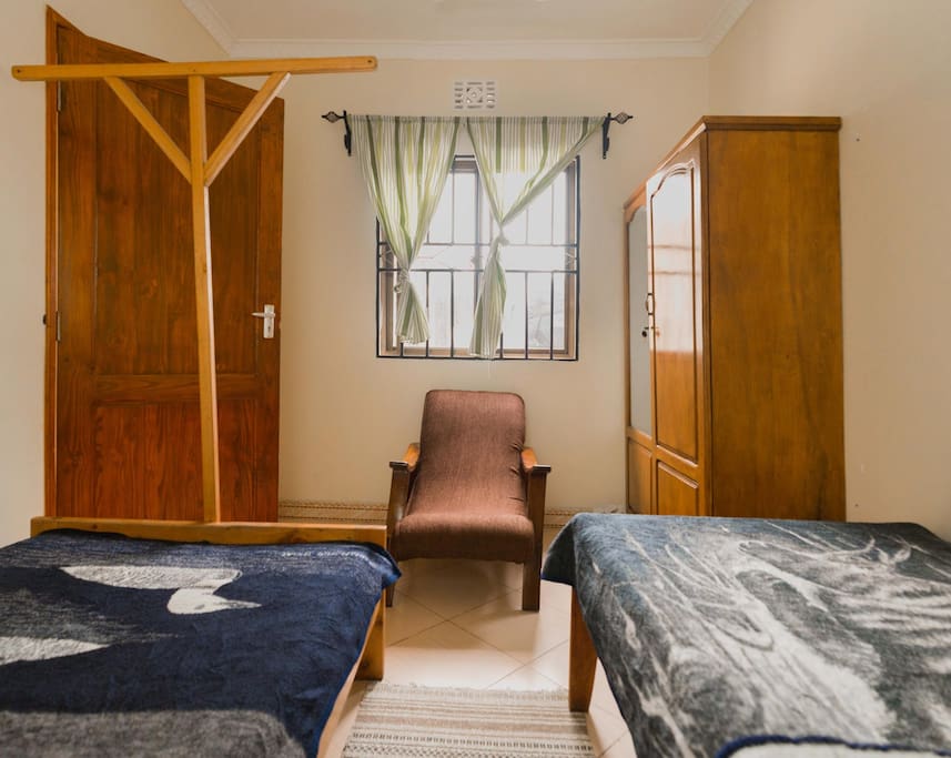 Second bedroom with 2 beds and a cabinet