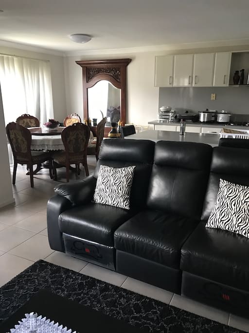 Clean dining area, lounge and modern kitchen are all accessible to guests.