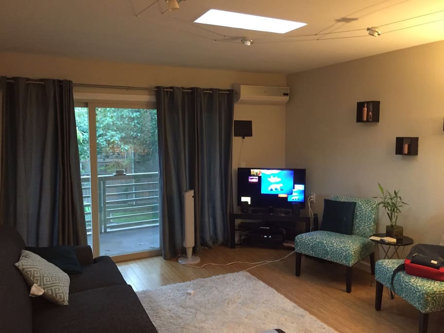 Living Room with Sectional Couch + Balcony