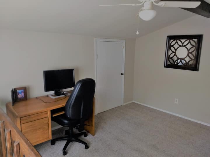 The office space is shotgun-style with the bedroom connected.  There is plenty of floor space for a blow-up mattress if needed.