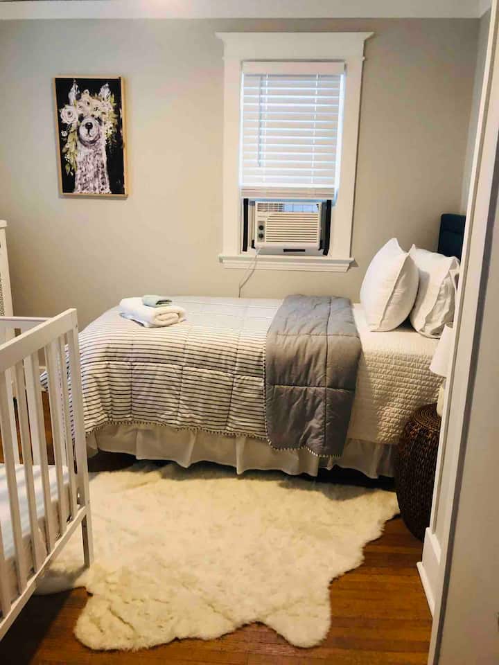 Adorable twin bedroom + crib room
