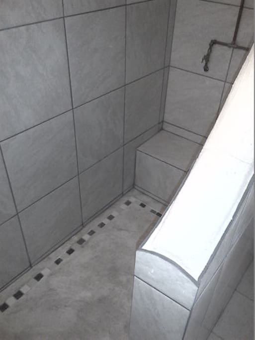 Large walk-in shower, towels and soap provided