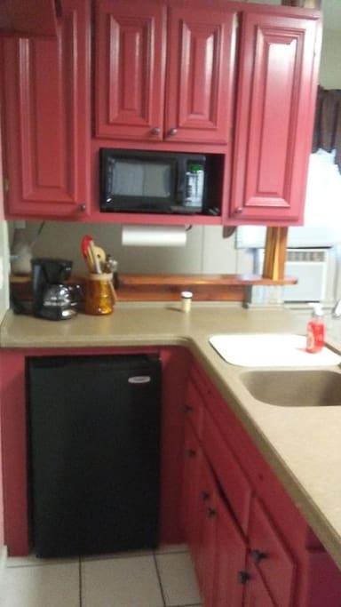 Kitchenette features: Microwave coffee pot, mini fridge and crock pot.