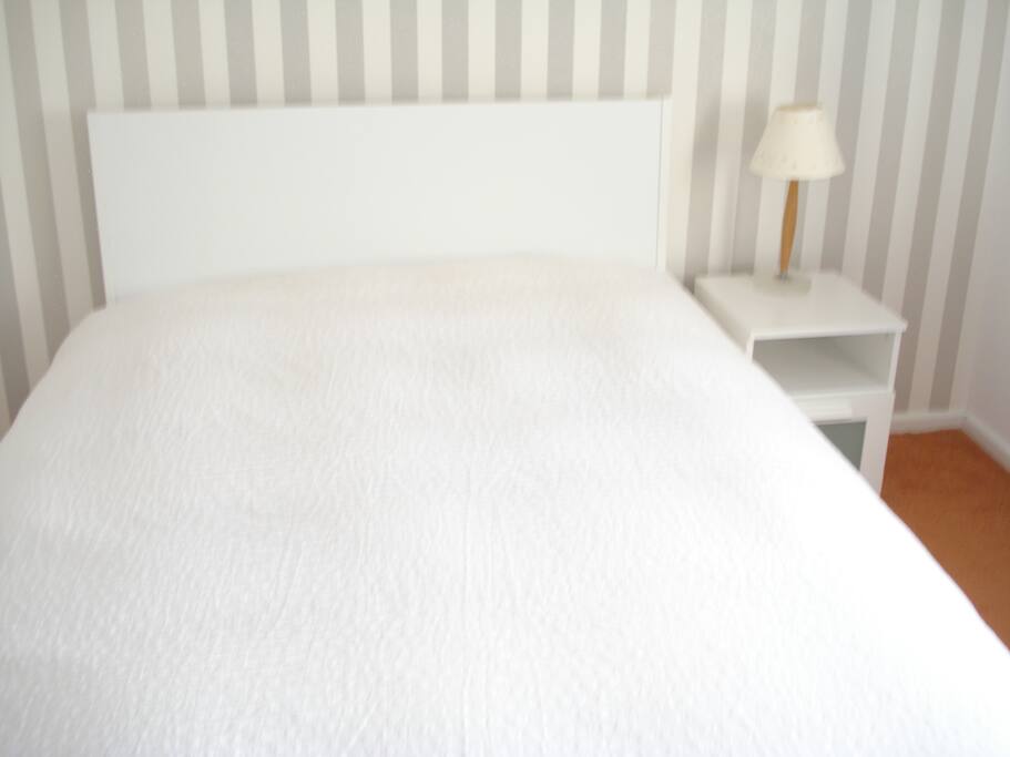 Warm, clean & comfortable double bedroom, with television and wardrobe.