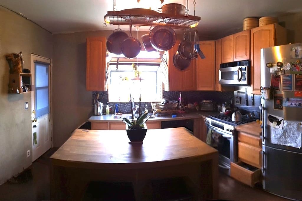 Butcher block island with cafe seating.