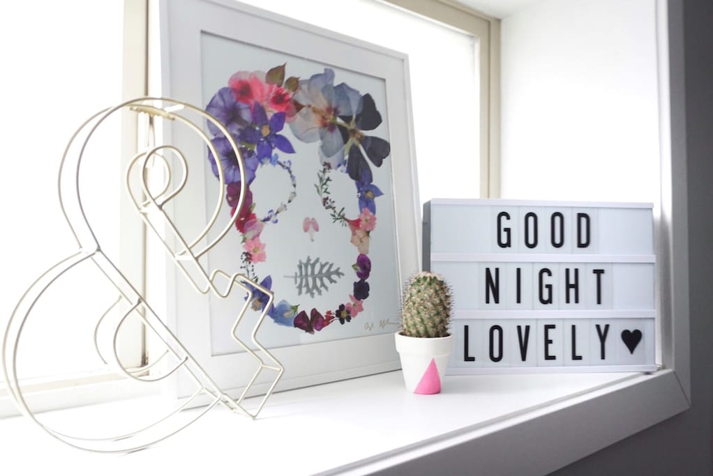 The room and rest of the home is thoughtfully decorated and full of fun local art.