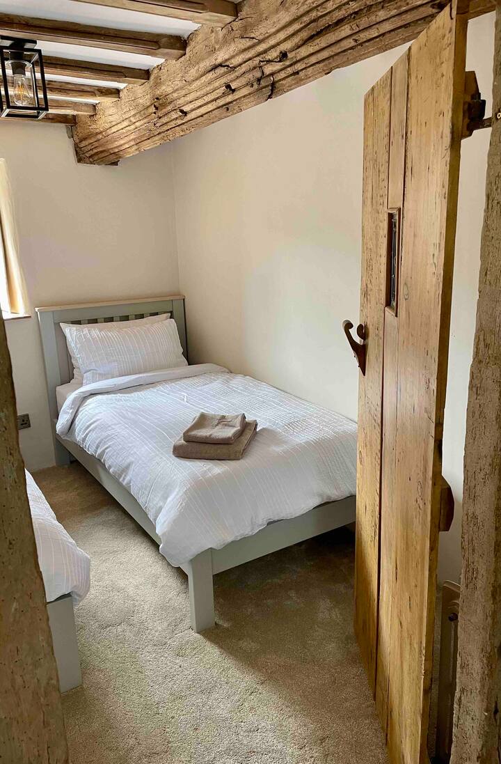 Our second bedroom features two Cotswolds company single beds