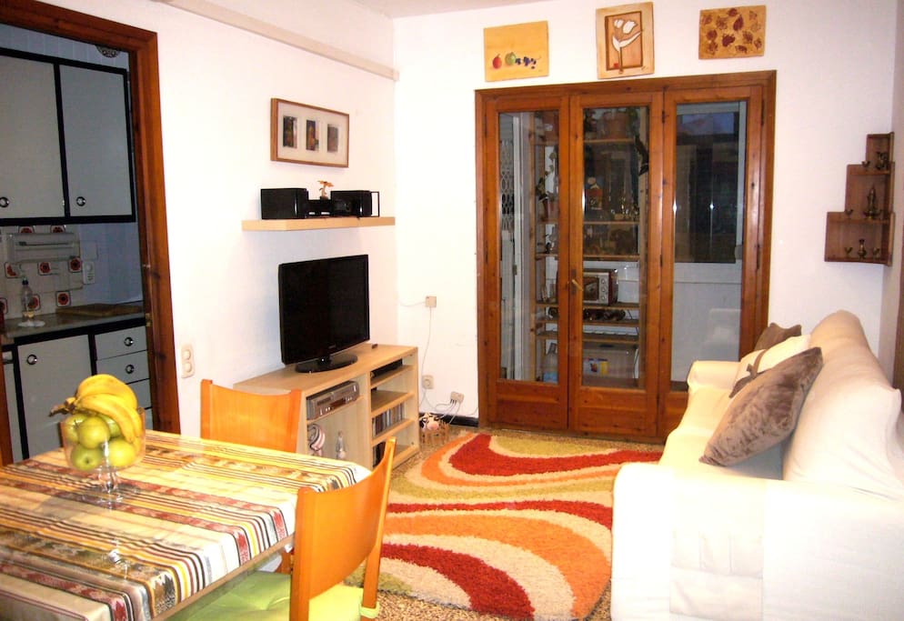 salon with table, TV, sofa for sleeping and relaxing