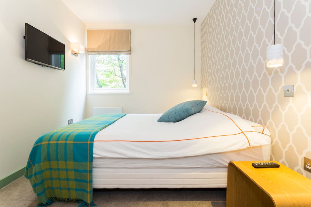 Master bedroom with 160cm wide comfy bed and flat screen TV