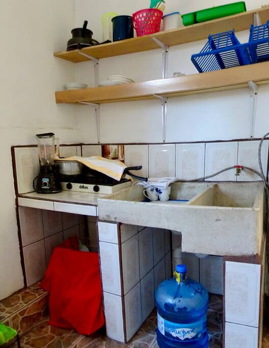 Kitchen and Sink in bedroom.