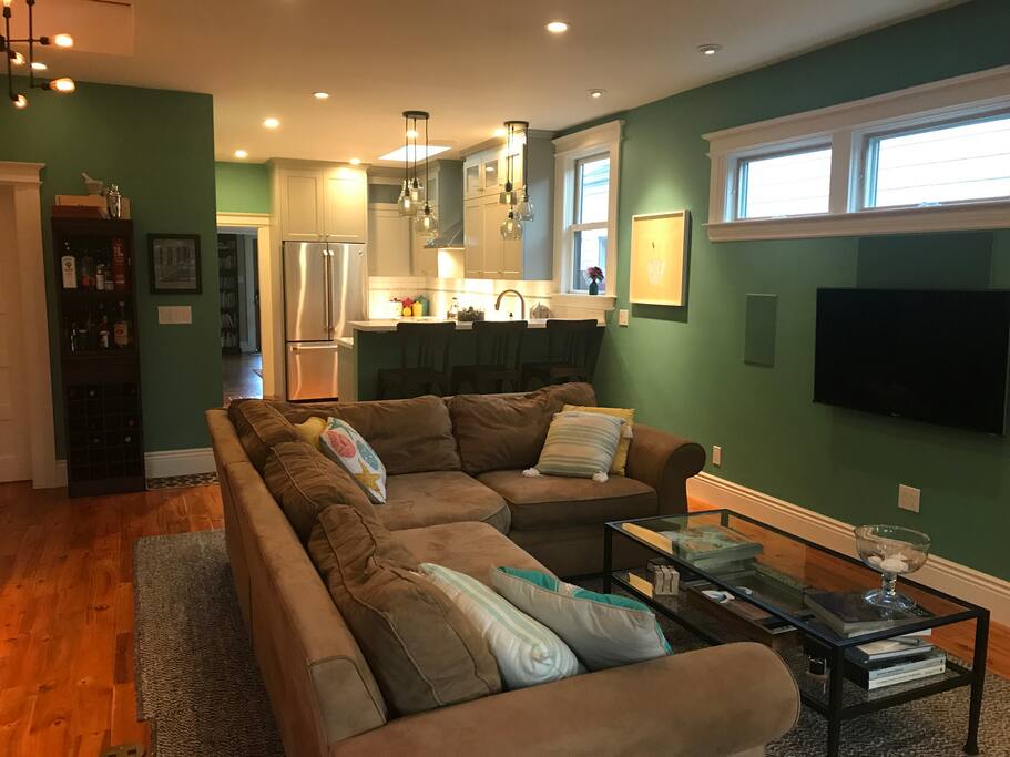 The kitchen opens up into the living room and features built-in surround speakers