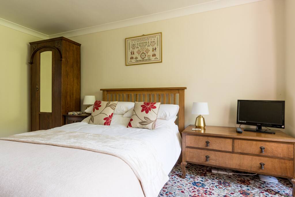 Bedroom 1, viewed from the fireplace.