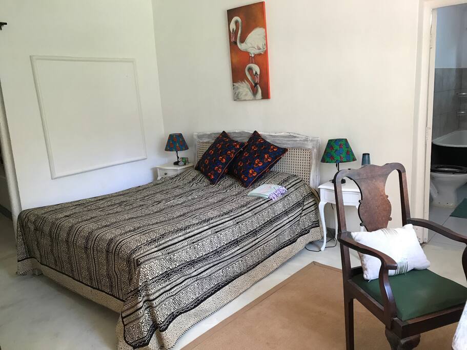 Spacious white washed furniture and comfortable bed