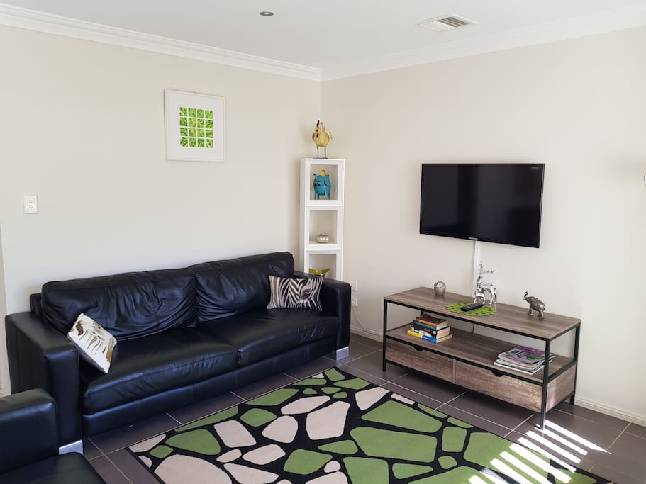 Light filled lounge with futon, DVD's & books