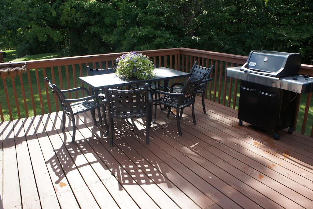 The deck area is huge and overlooks the wooded back yard. There is seating for 6 on the deck and additional seating for children (if needed) with a children's picnic table (not pictured).