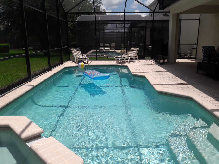 Private pool with spillover spa in screened-in lanai