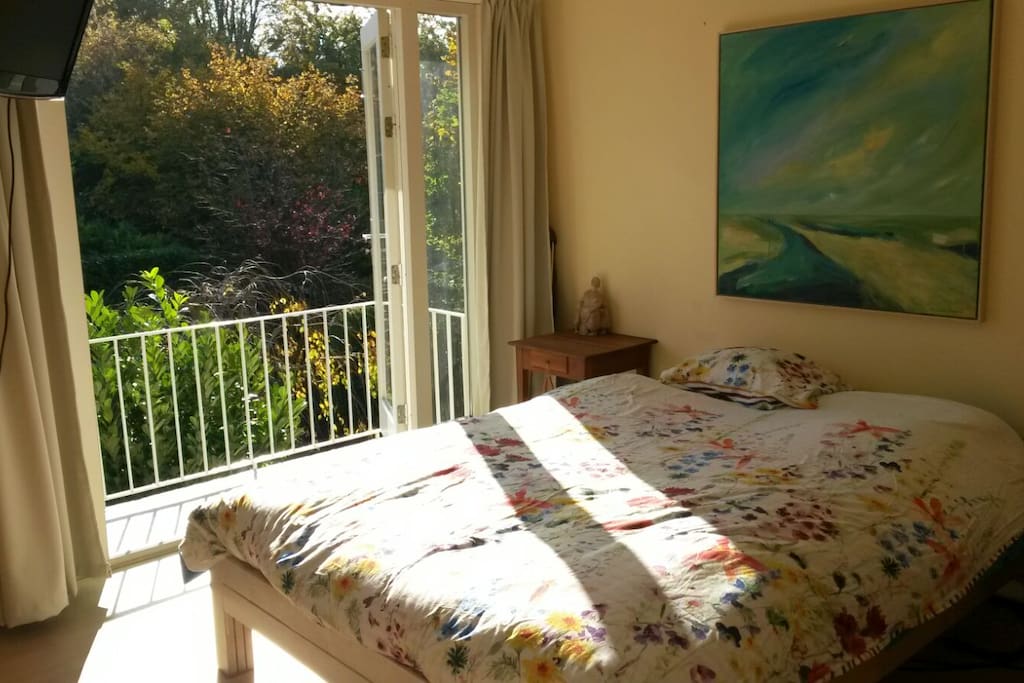 large sleepingroom with balcony at the sunny side first floor