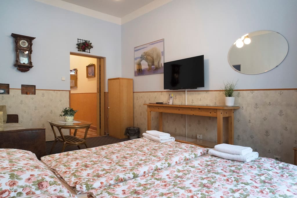 Bedroom with a double bed and an unfolding sofa bed