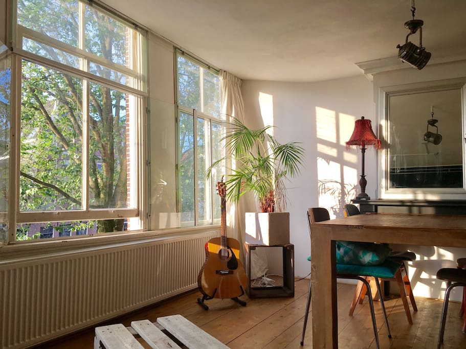 Three window living room, music and desk area