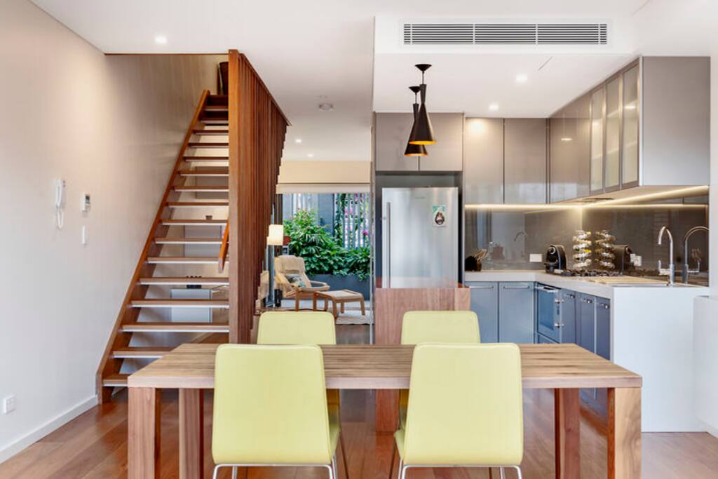 Sunny dining with bi-folding doors and a rear courtyard