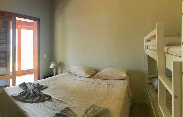 Bedroom with queen-size bed and bunk bed