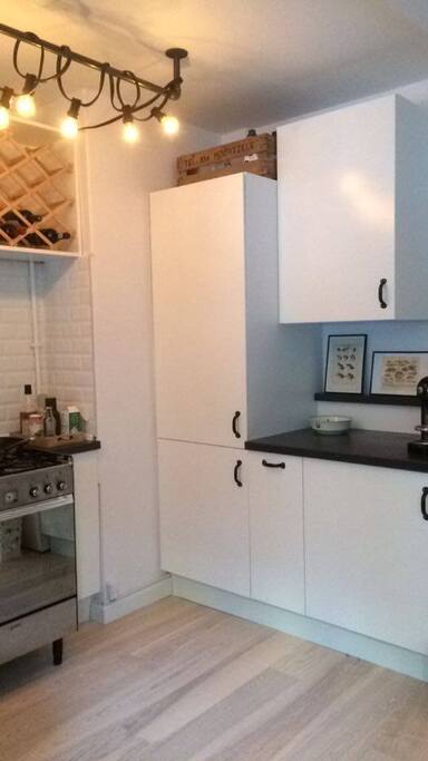 The right side of the kitchen.