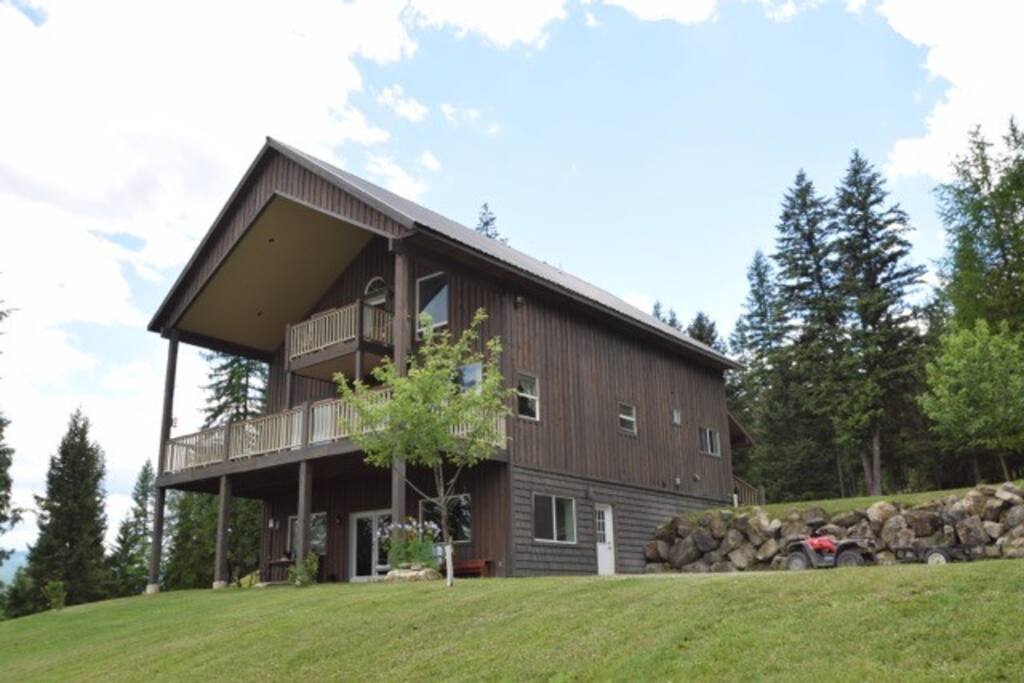 Back side of house. Balcony and decks overlook the views of the meadows and mountains