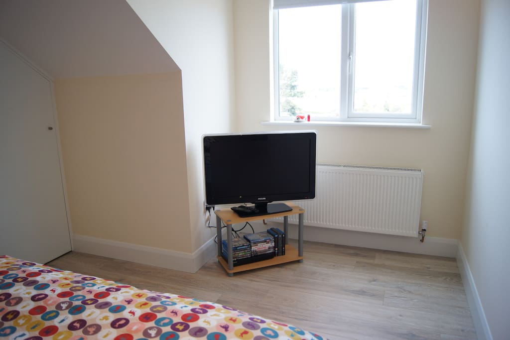 En-suite bedroom with TV and some DVD's