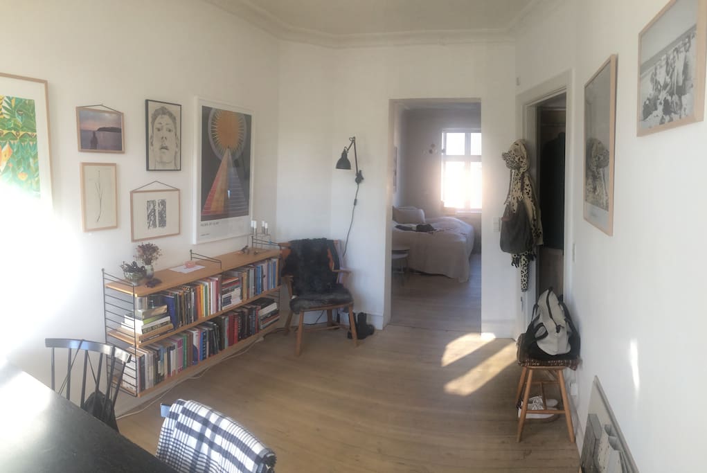 The living room with an open doorway to the entrance and the bedroom