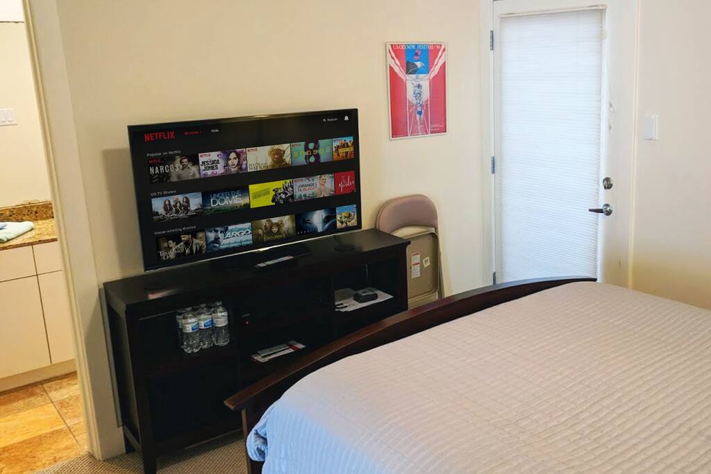 Netflix and Amazon Prime on the big TV. Private entrance from outside is on the right. Private bathroom is on the left.