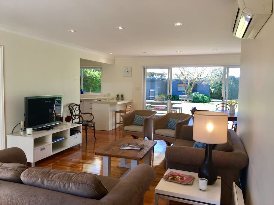 Open family lounge, kitchen, dining which all opens up to a large north facing deck and lawn backyard