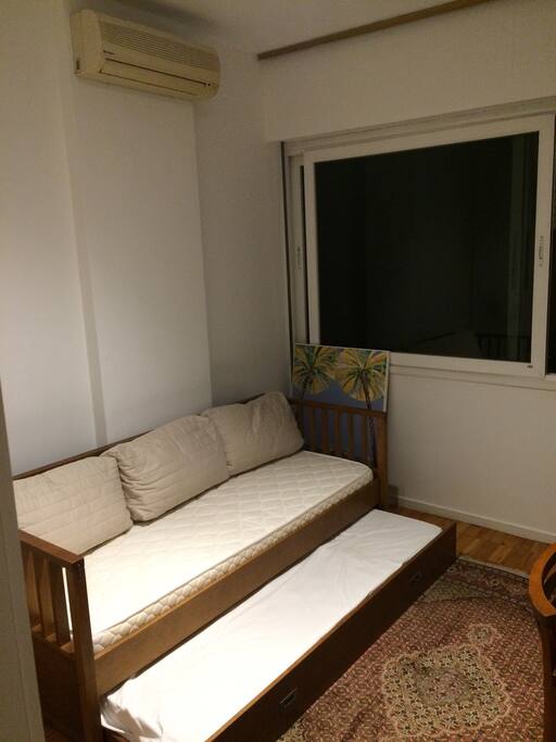 Sofa during the day, two single beds during the night. Air conditioning to keep it cool in the summer.
