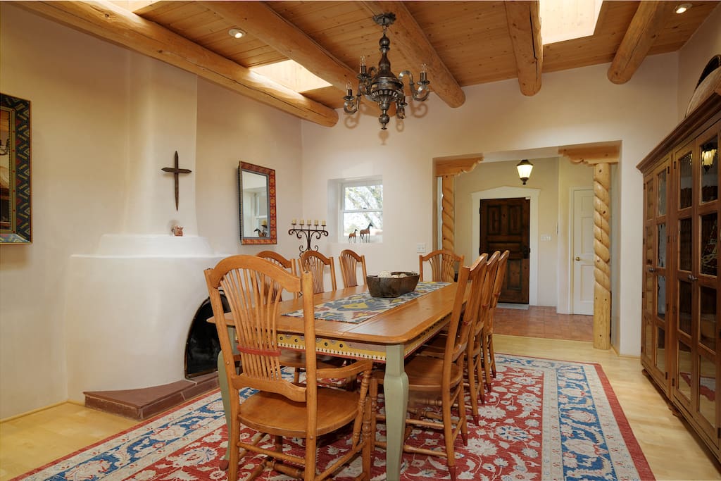 Dining room with hand carved architectural details and custom hand made dining set
