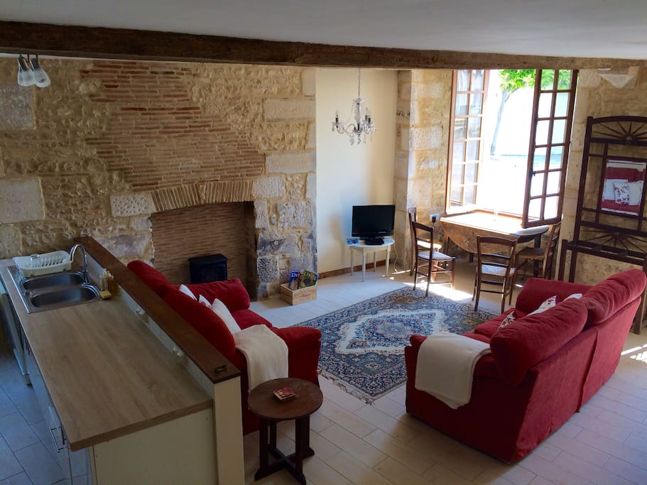 Main lounge, with views over the Chateau and village square, overflowing with original features
