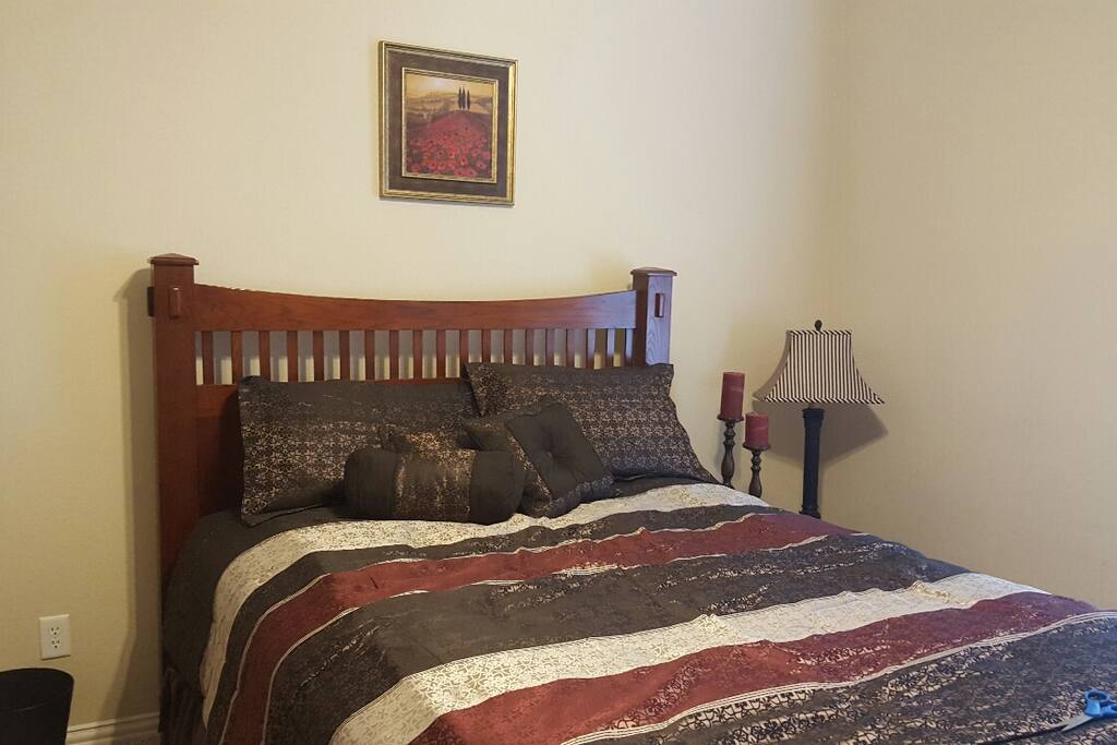 bedroom with queen bed and desk