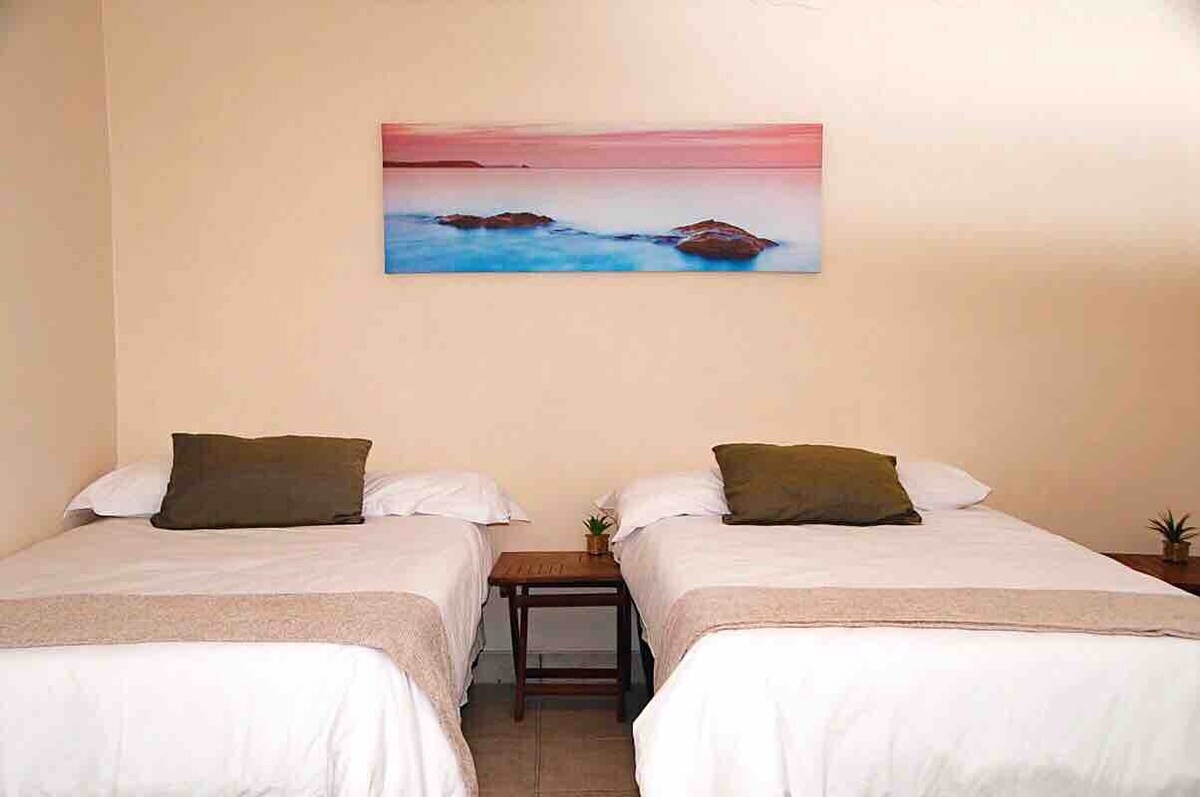 2 Extra single beds in spacious basement room with access to bedroom 3. Sharing bathroom with bedroom 3.