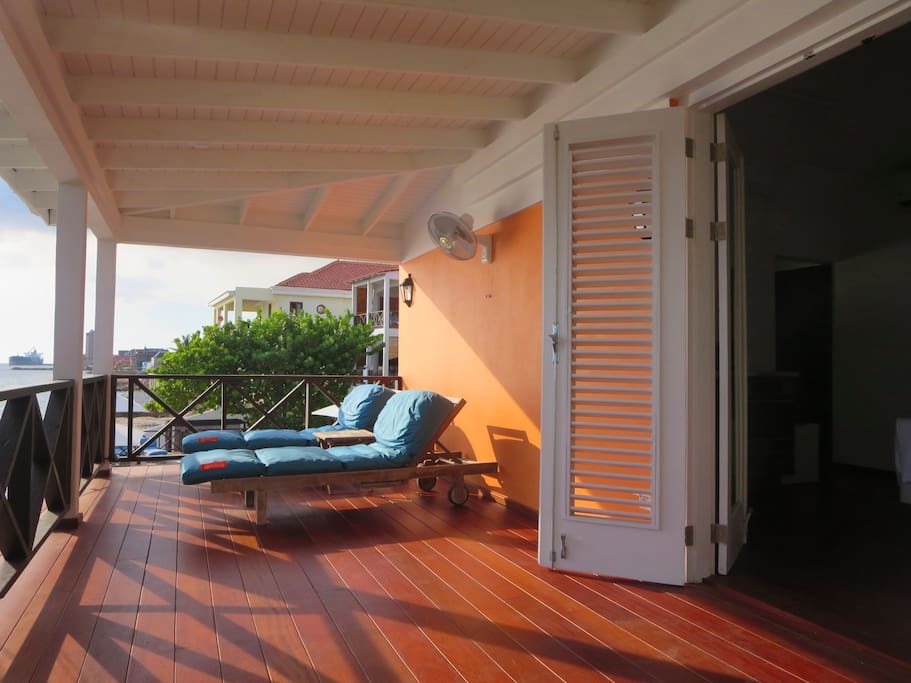 Your balcony offers stunning views over the pool and ocean.