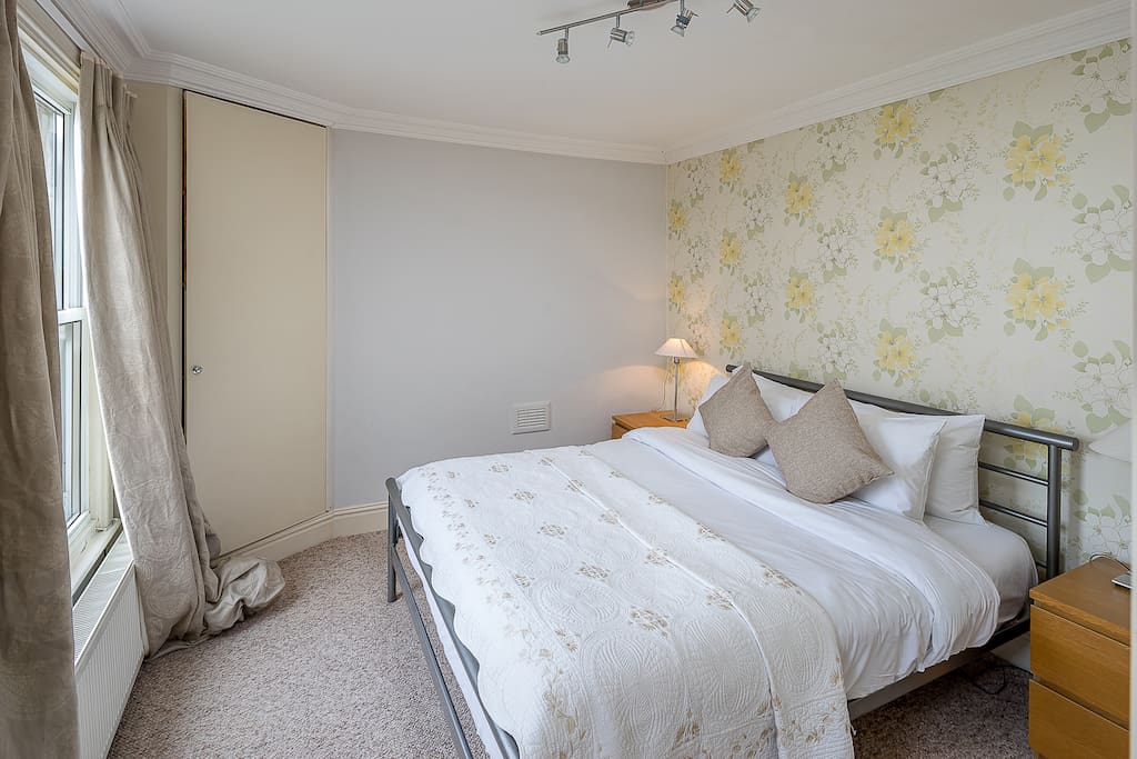 Master bedroom with a king size bed